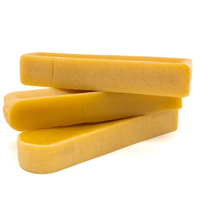 Three large Himalayan Yak Chews from Bully Bunches stacked on top of one another.